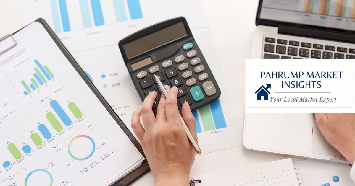 Desk with market financial charts, calculator, and laptop featuring Pahrump Market Insights branding for the weekly mortgage market update.
